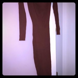 A brown fitted dress with open back.